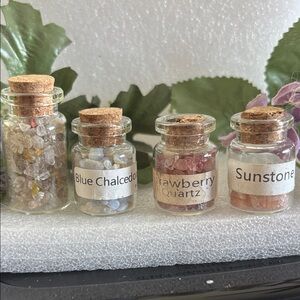 4 Crystal bottles-blue chalcedony, strawberry quartz, sunstone, mixed quartz